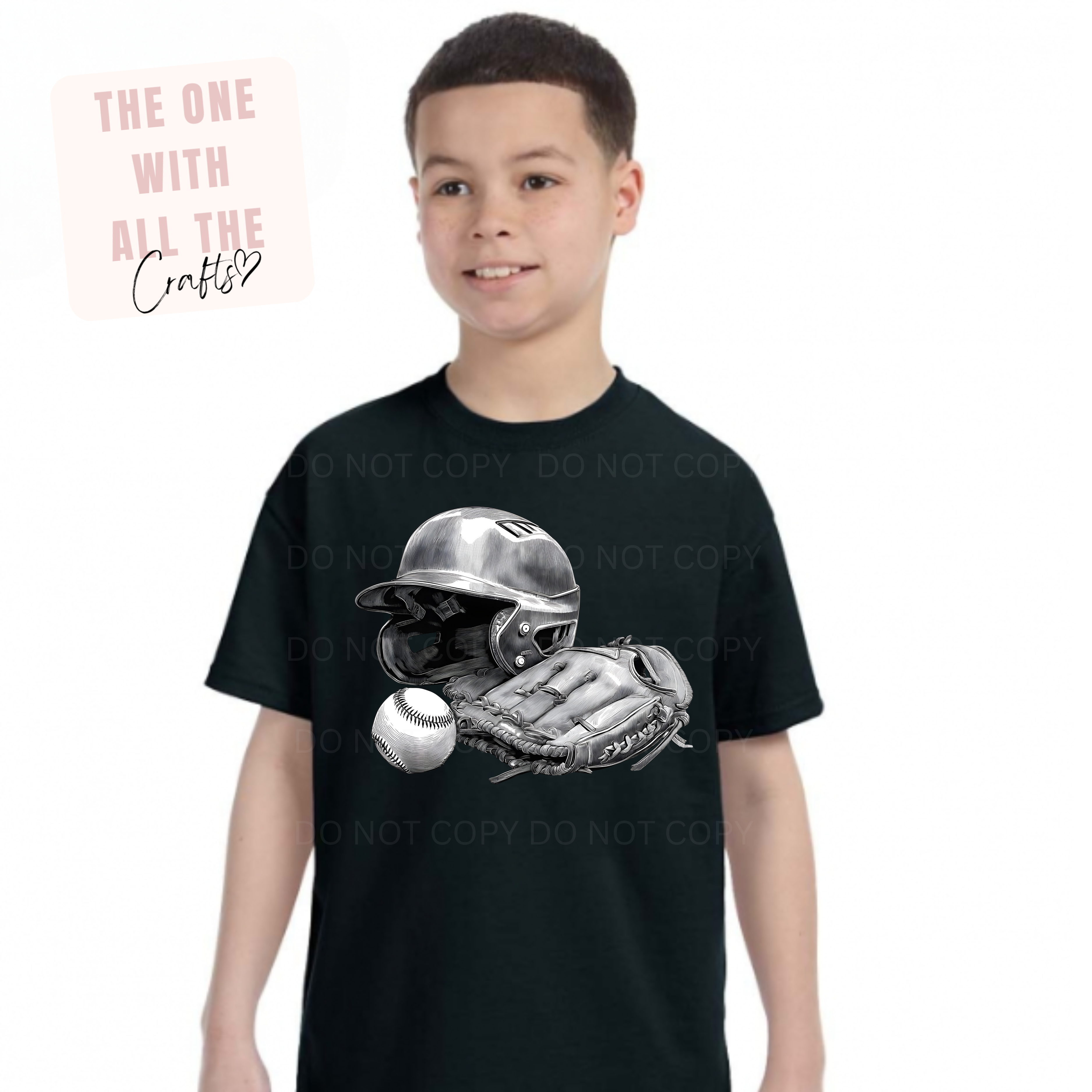 Child wearing a black t-shirt with a graphic design of a baseball helmet, glove, and ball.