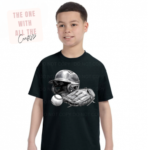 Child wearing a black t-shirt with a graphic design of a baseball helmet, glove, and ball.