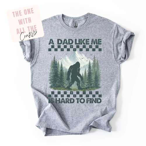 Gray t-shirt with a graphic of a bear in a forest and text on a white background