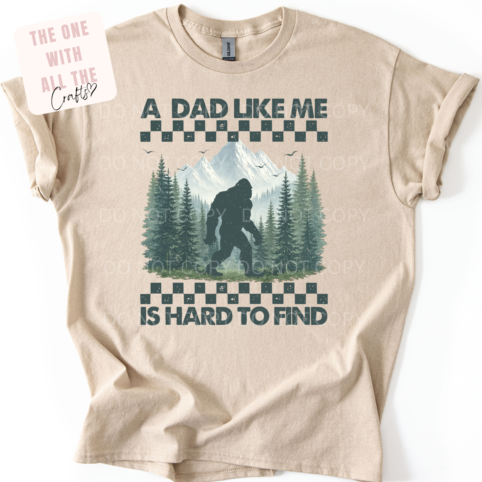 Beige t-shirt with graphic design and text on a white background