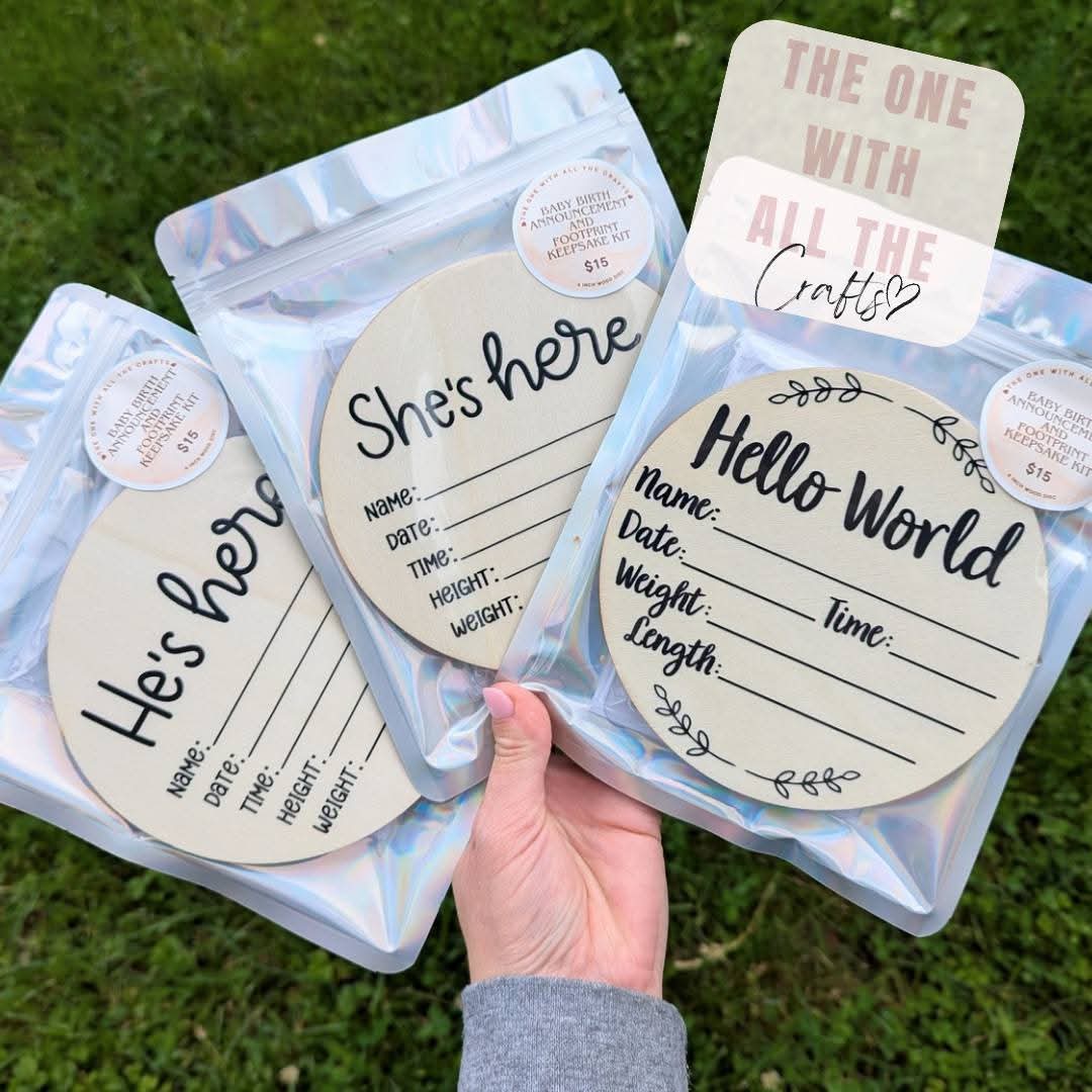 Three clear plastic bags with round labels held by a hand on a grass background