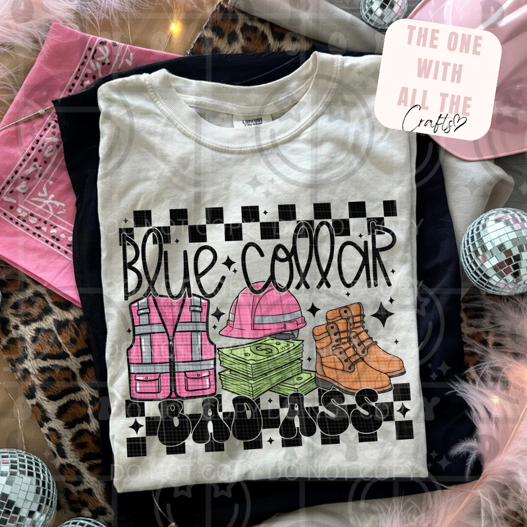 White t-shirt with 'Blue Collar Badass' graphic design on a patterned surface.