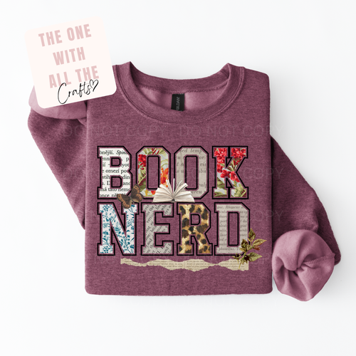 Purple sweatshirt with 'BOOK NERD' text on a white background