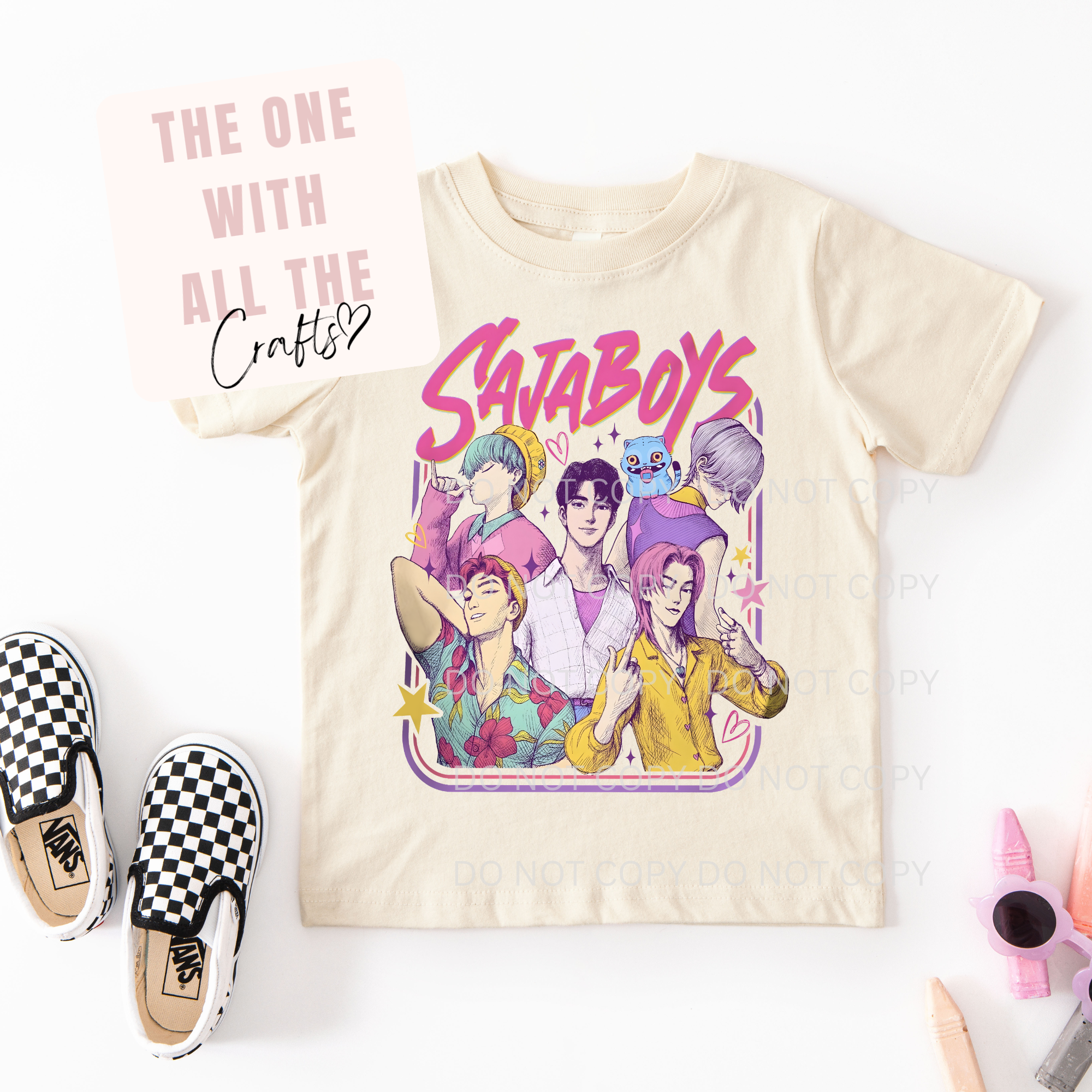 Beige t-shirt with colorful graphic design and text 'Saja Boys' on a white background.