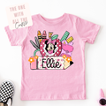 Pink t-shirt with a colorful mouse graphic and text on a pink background
