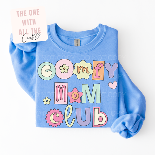 Blue sweatshirt with colorful 'Comfy Mom Club' text on a white background