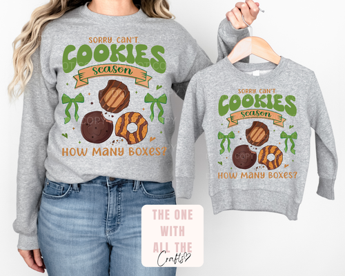 Two gray sweatshirts with a humorous cookie-themed design on a white background.