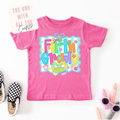 Pink t-shirt with 'Fifth Grade' design on a white and blue striped background