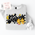 Gray sweatshirt with 'Teach' design featuring flowers and a bow on a white background