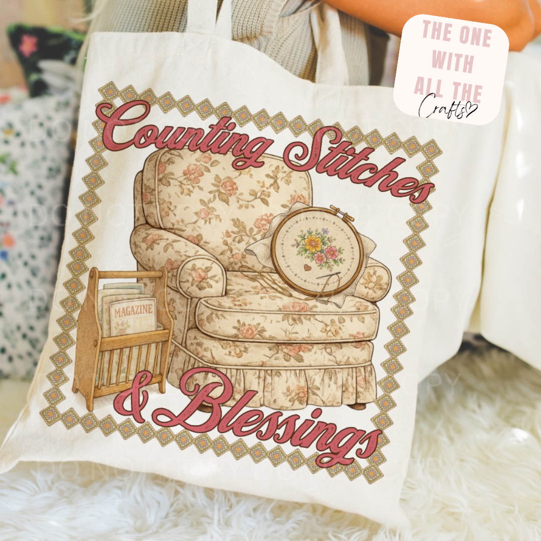 Tote bag with 'Counting Stitches & Blessings' design featuring an armchair and sewing hoop.