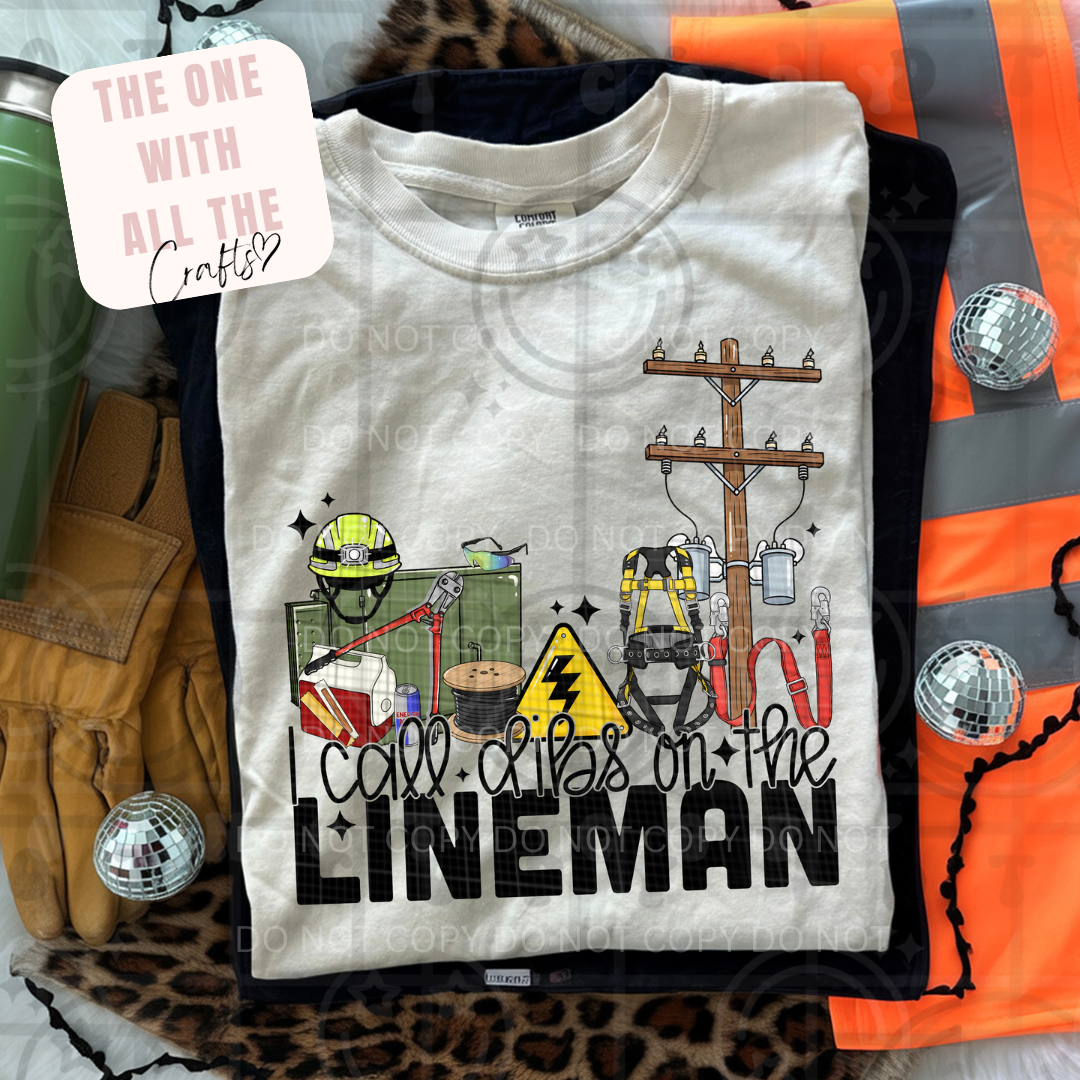 White t-shirt with lineman graphic and text on a colorful background