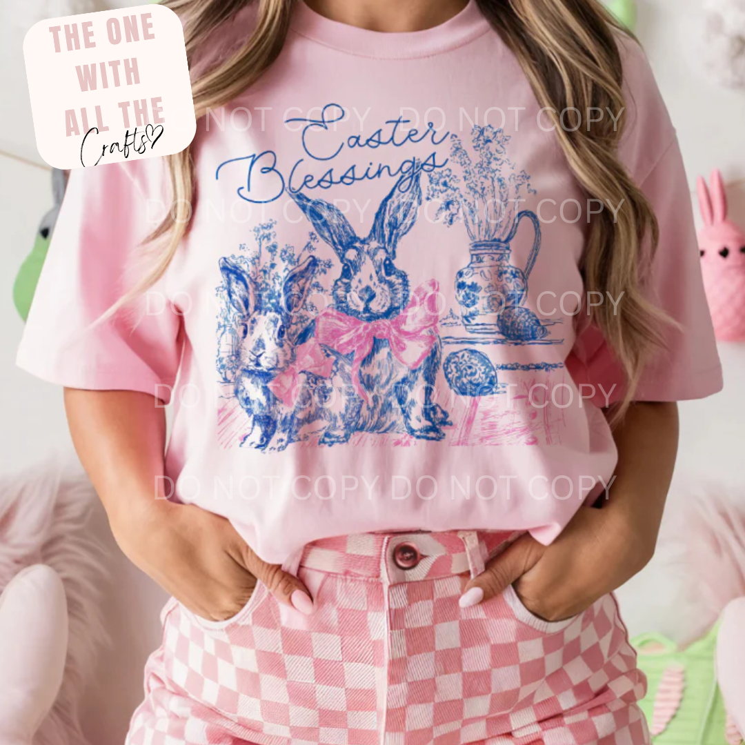 Person wearing a pink 'Easter Blessings' t-shirt with bunny designs.