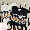 Two folded shirts with 'Everything is fine' text and flames design on a textured surface.