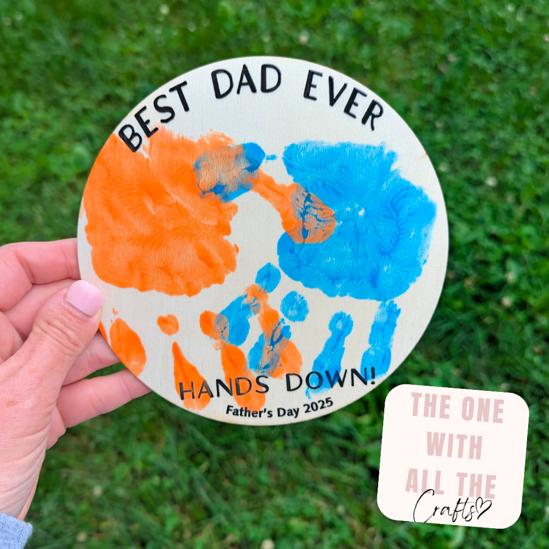 Handmade Father's Day card with handprints and text on a grass background