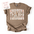 Brown t-shirt with 'Teacher' text and floral design on a white background