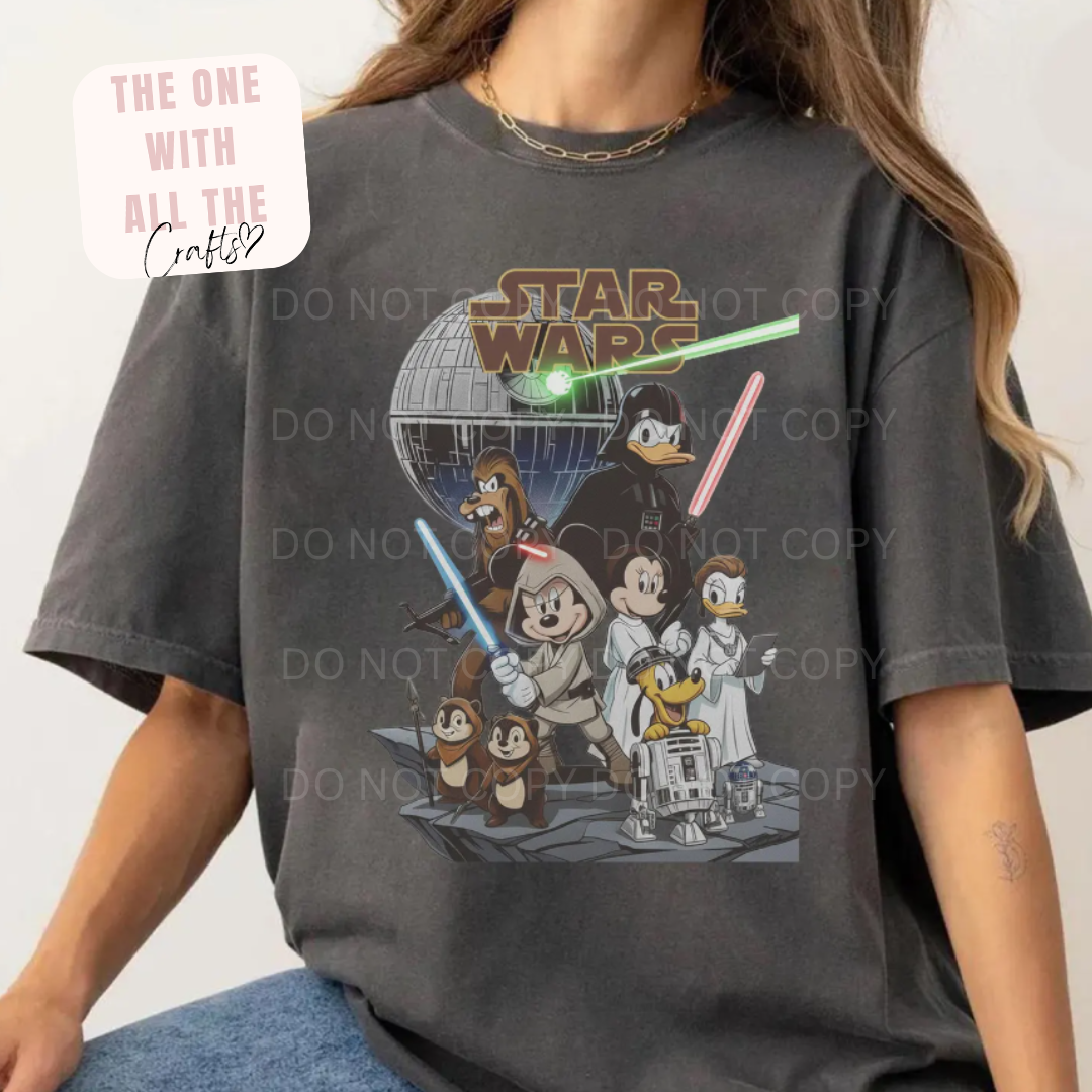Person wearing a dark gray t-shirt with a Star Wars-themed graphic featuring cartoon characters.