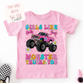 Pink t-shirt with a monster truck graphic and text on a white background