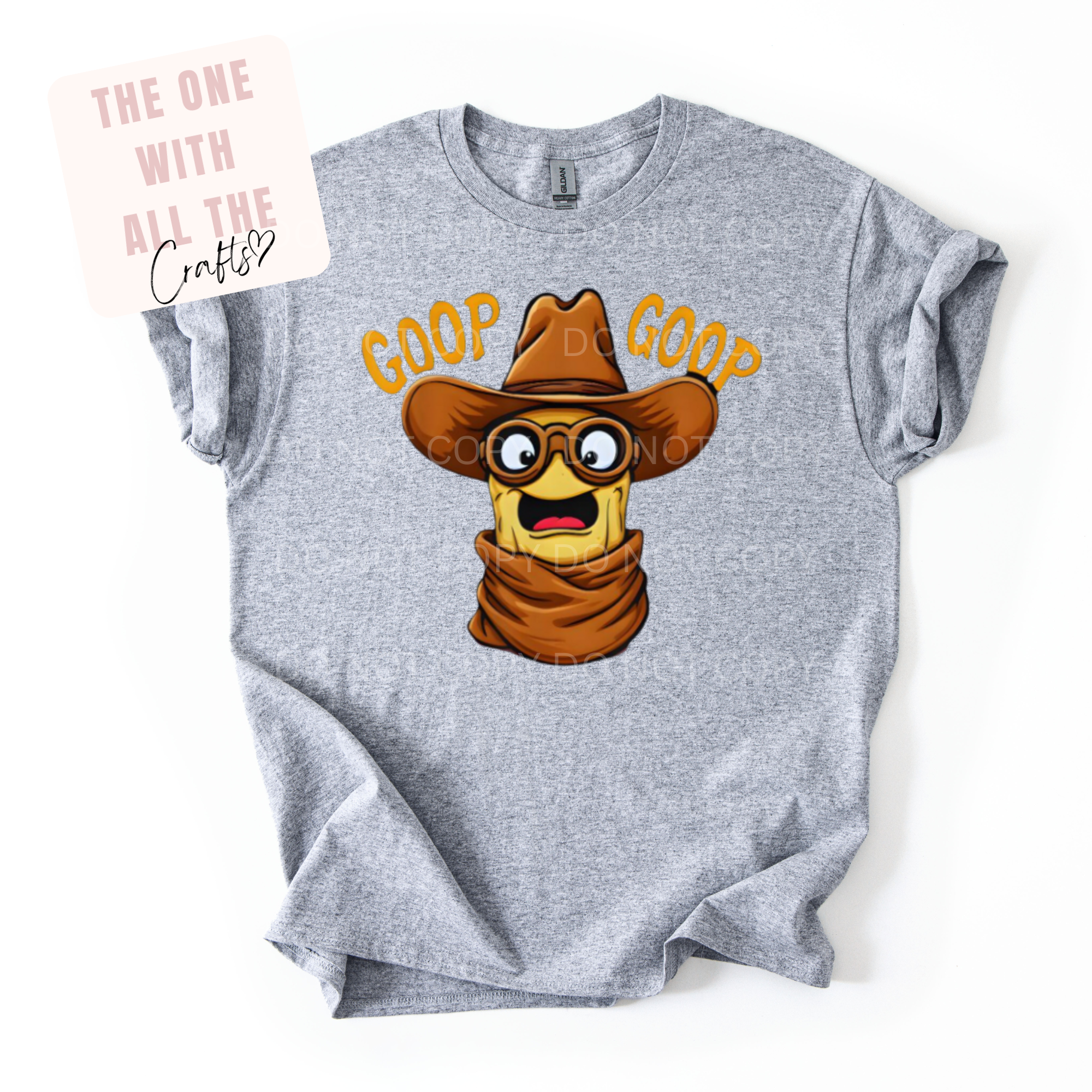Gray t-shirt with peanut cartoon character wearing a cowboy hat and scarf, text 'GOOF GOOD' on a white background.