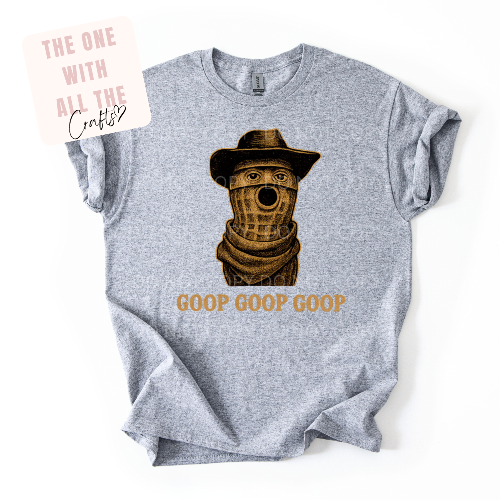 Gray t-shirt with a graphic of a peanut character wearing a hat and scarf, and 'GOOP GOOP GOOP' text on a white background.