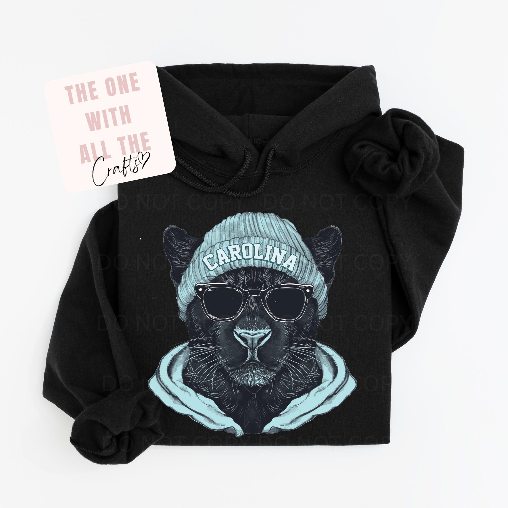Black hoodie with a graphic of a panther wearing a 'Carolina' beanie and sunglasses, on a white background.
