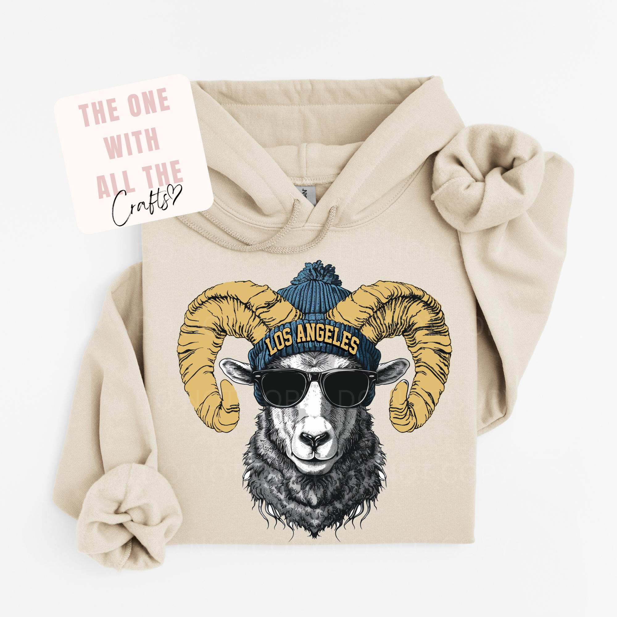 Beige hoodie with a graphic of a ram wearing sunglasses and a 'Los Angeles' beanie on a white background.