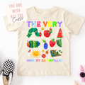 Children's t-shirt with colorful caterpillar design and text on a white background