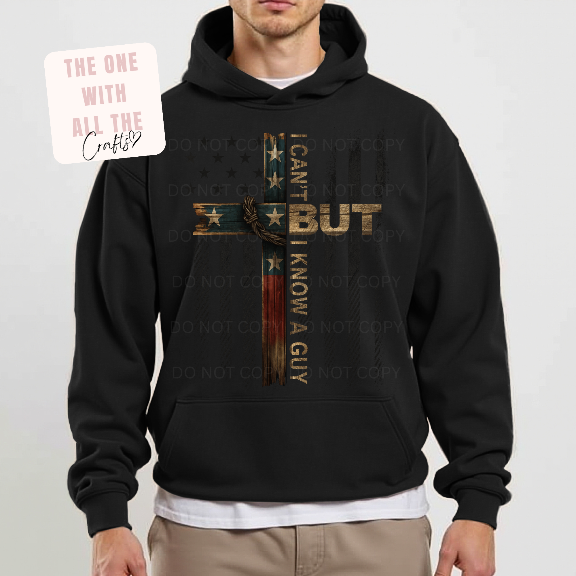 Black hoodie with graphic design and text worn by a person on a white background