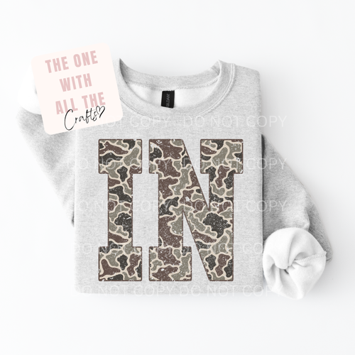 Gray sweatshirt with camouflage letter 'N' on a white background