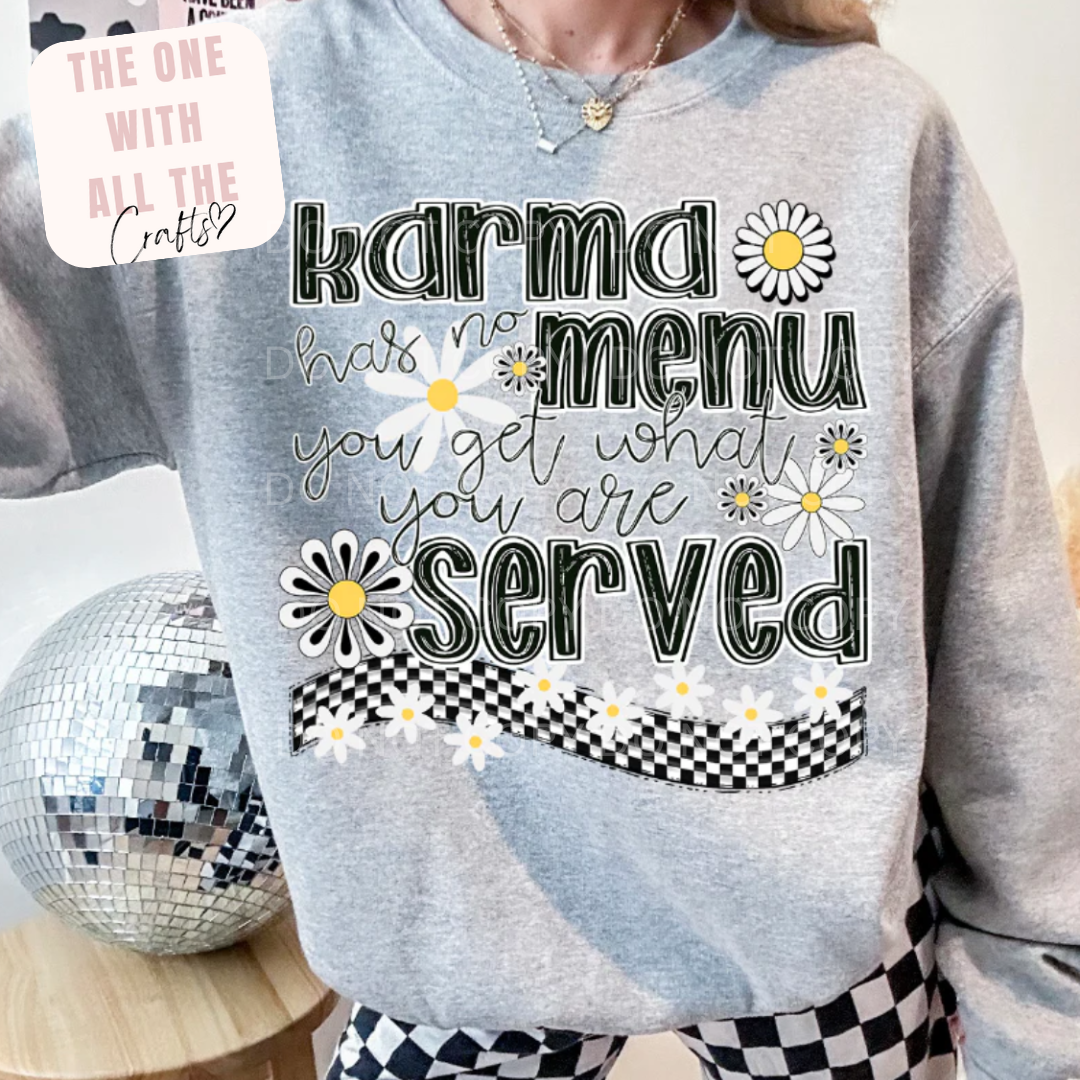 Gray sweatshirt with text and daisy graphics worn by a person, with a disco ball in the background.