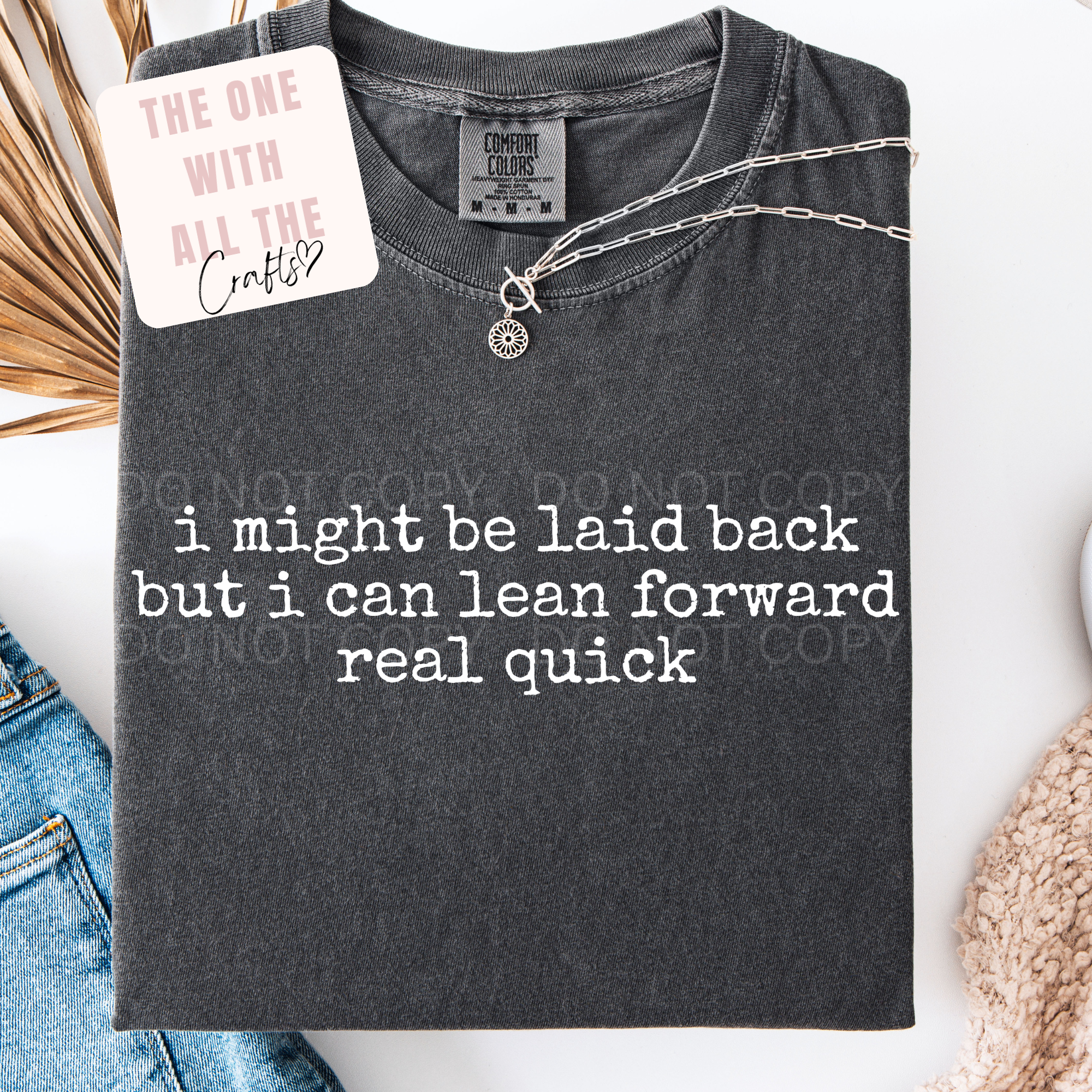 Gray t-shirt with humorous text design on a white background