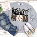 Gray sweatshirt with 'Loud & Proud Baseball Mom' text and baseball graphic, paired with jeans and sneakers on a wooden surface.