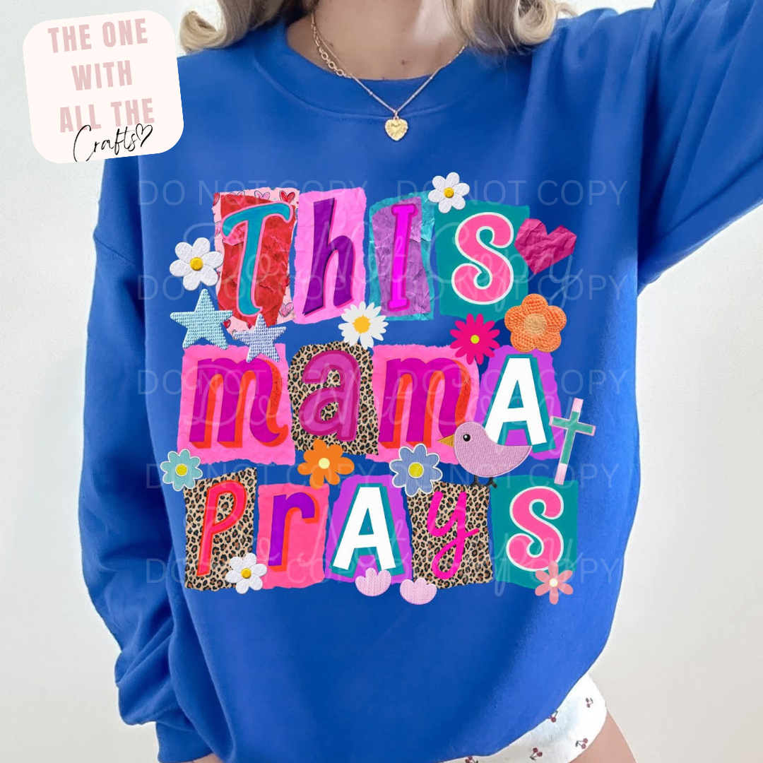 Blue sweatshirt with colorful text and graphics on a white background