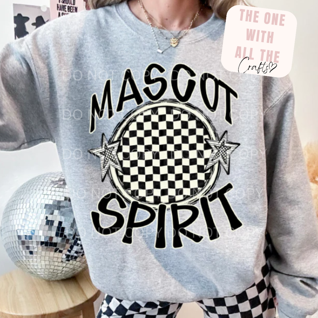 Person wearing a sweatshirt with 'Mascot Spirit' design in a casual setting