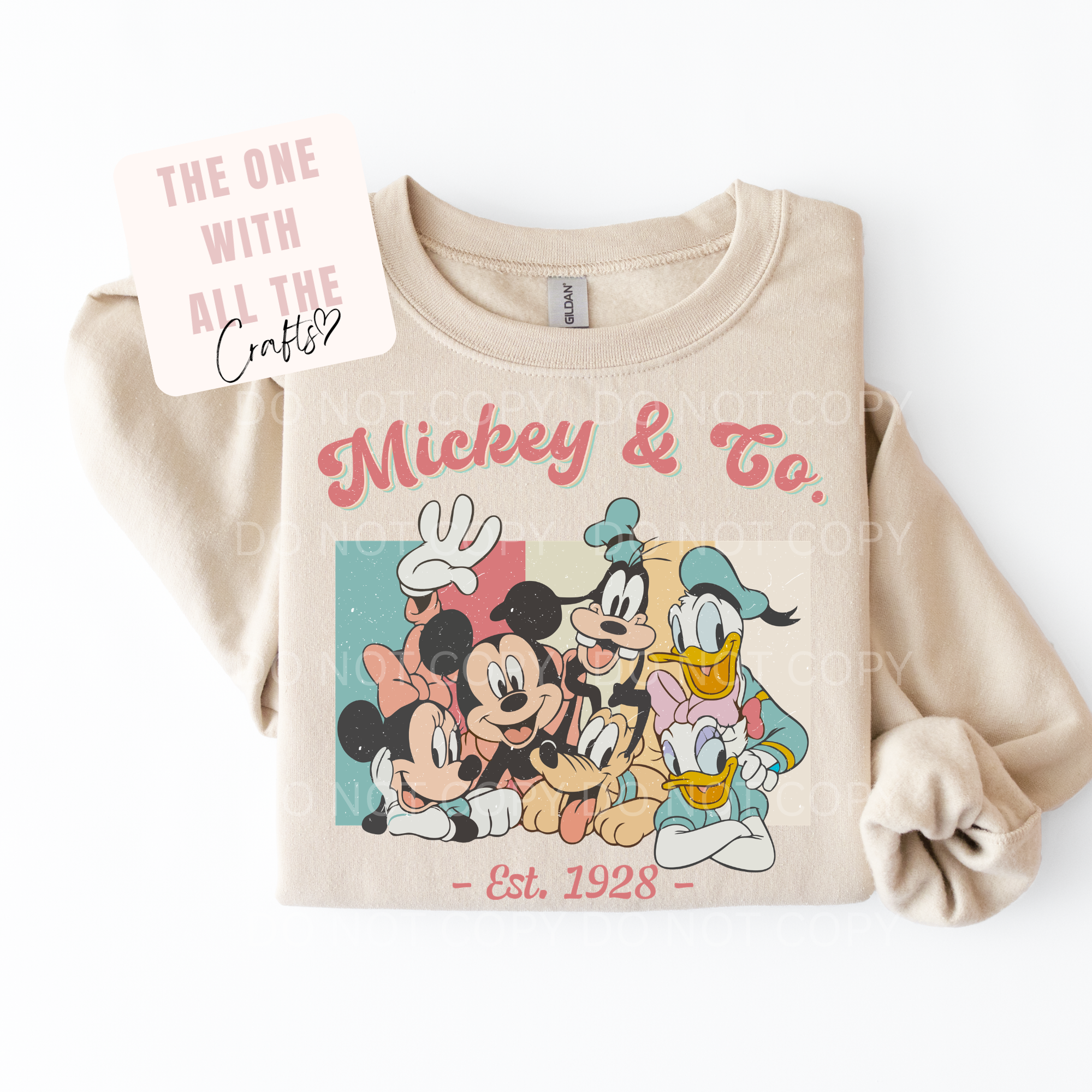 Beige sweatshirt with Mickey & Co design on a white background