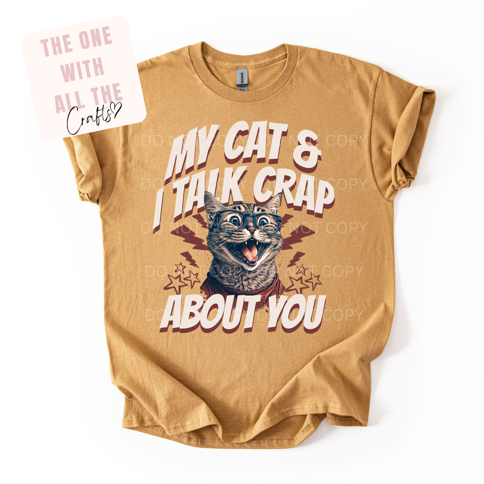 Beige t-shirt with a cat graphic and text on a white background