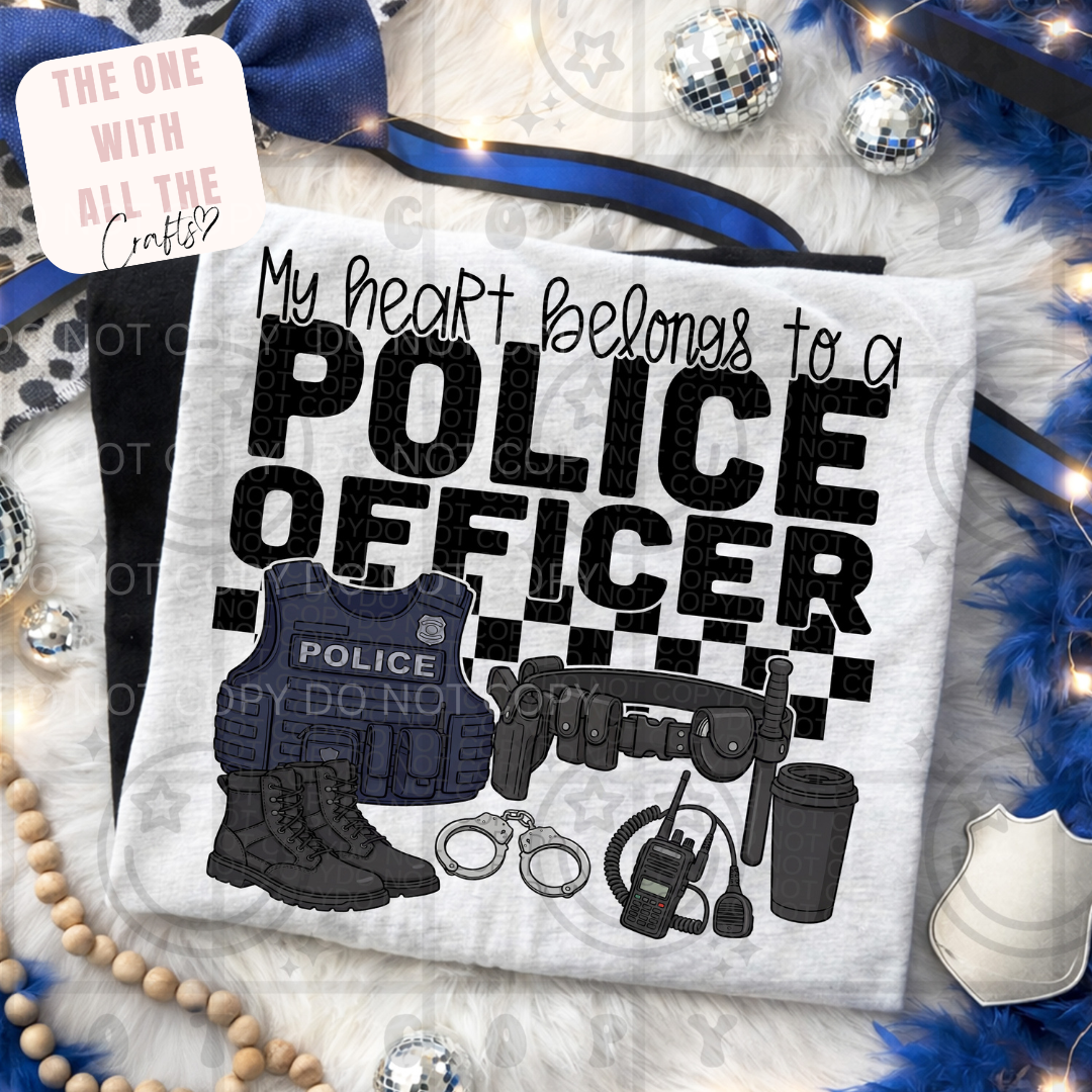 T-shirt with 'My heart belongs to a police officer' text and police-themed graphics on a decorative background.