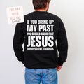 Person wearing a black sweatshirt with a humorous text design on the back, standing against a plain background.