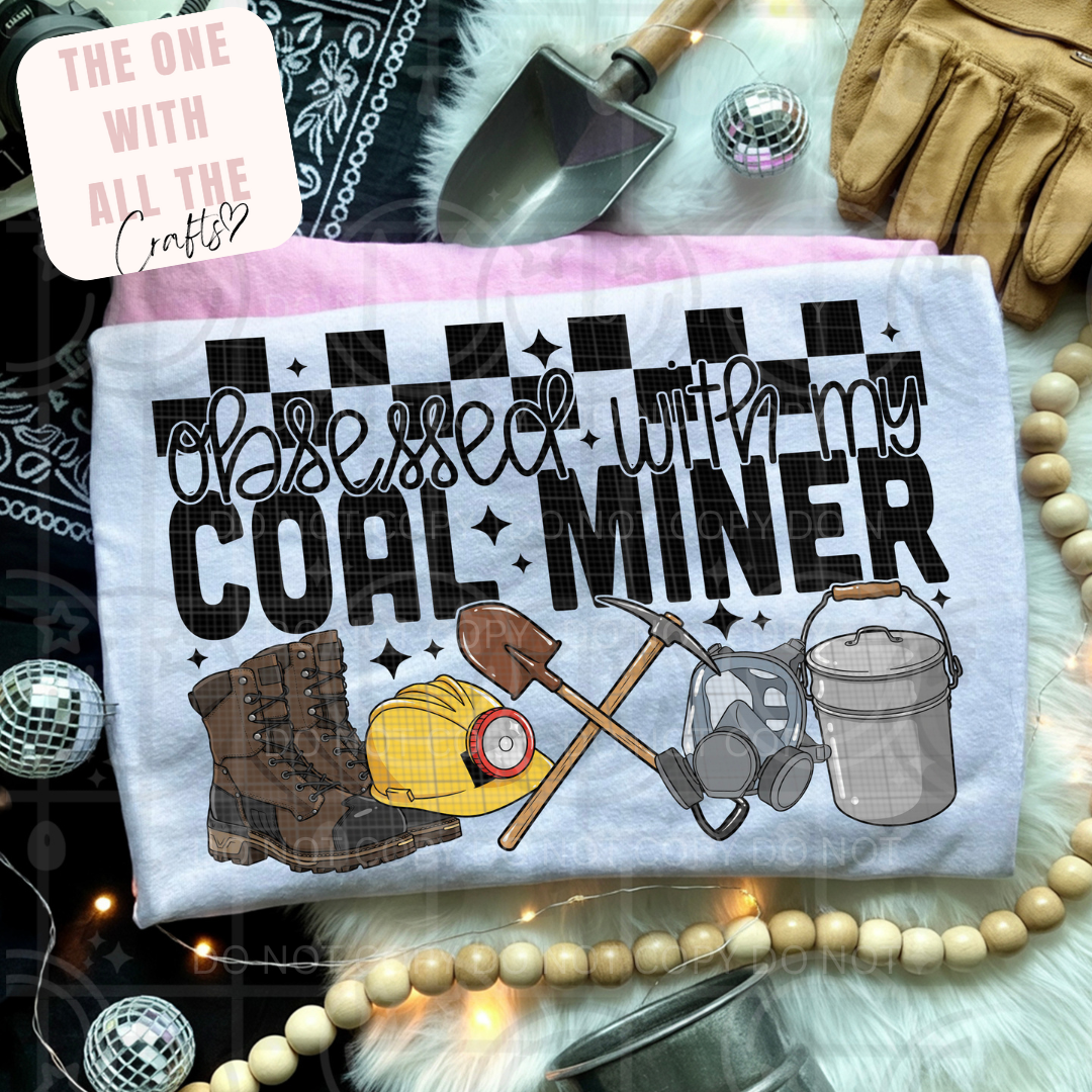 T-shirt with 'Obsessed with my Coal Miner' design on a decorative background with tools and jewelry.