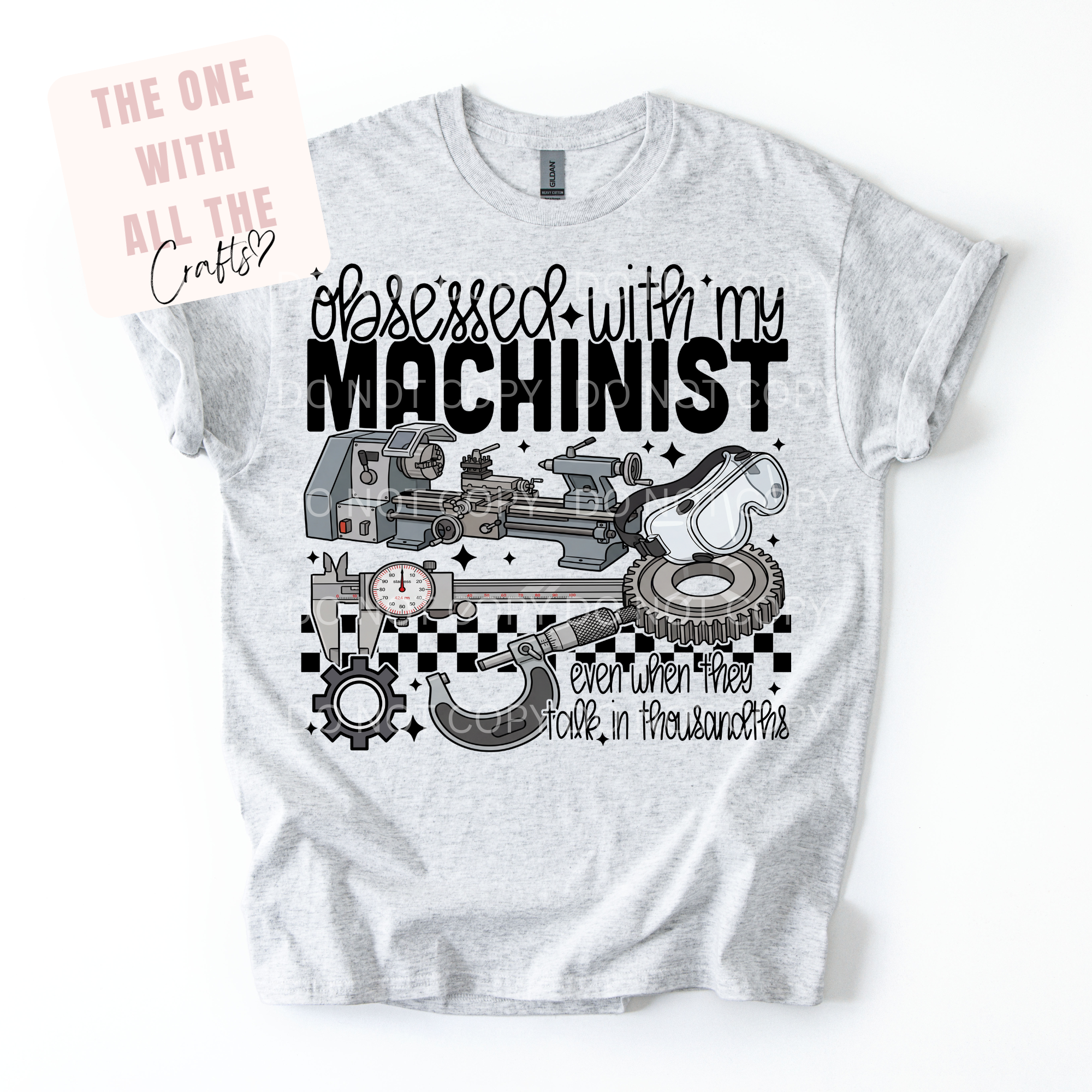 Gray t-shirt with black graphic design and text on a white background