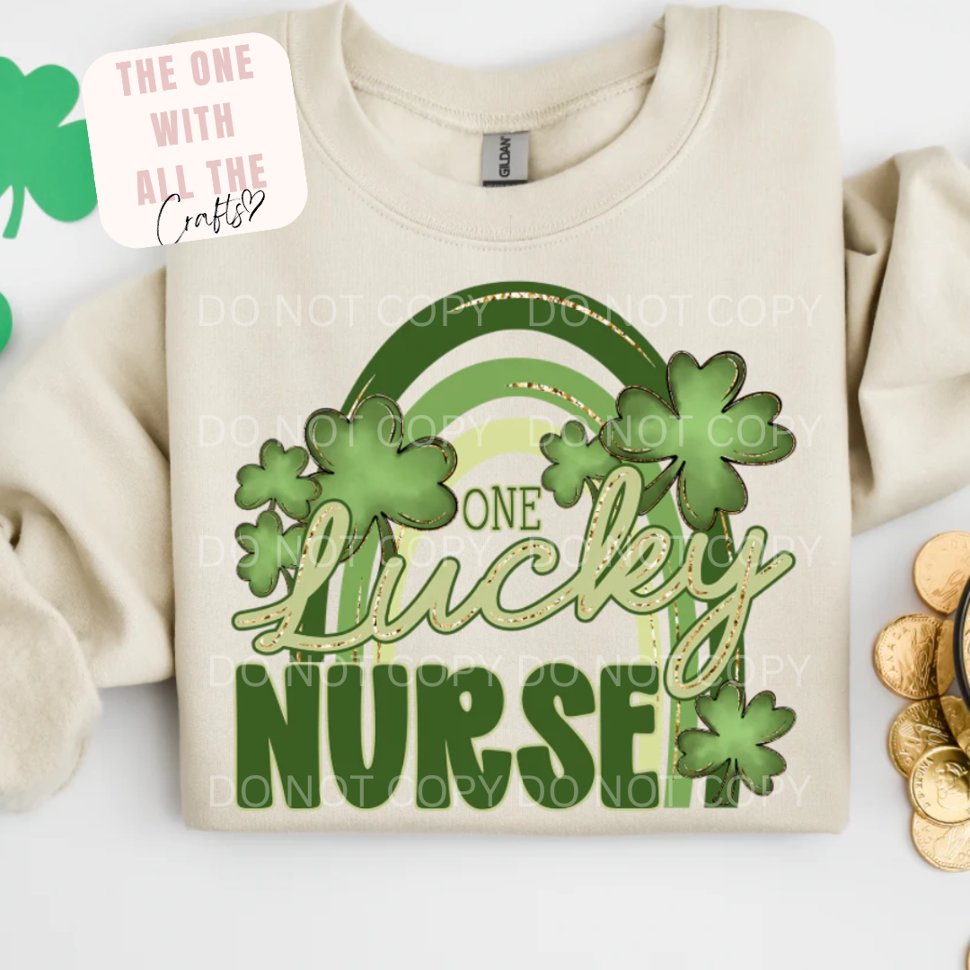 Beige sweatshirt with 'One Lucky Nurse' design featuring shamrocks on a white background.