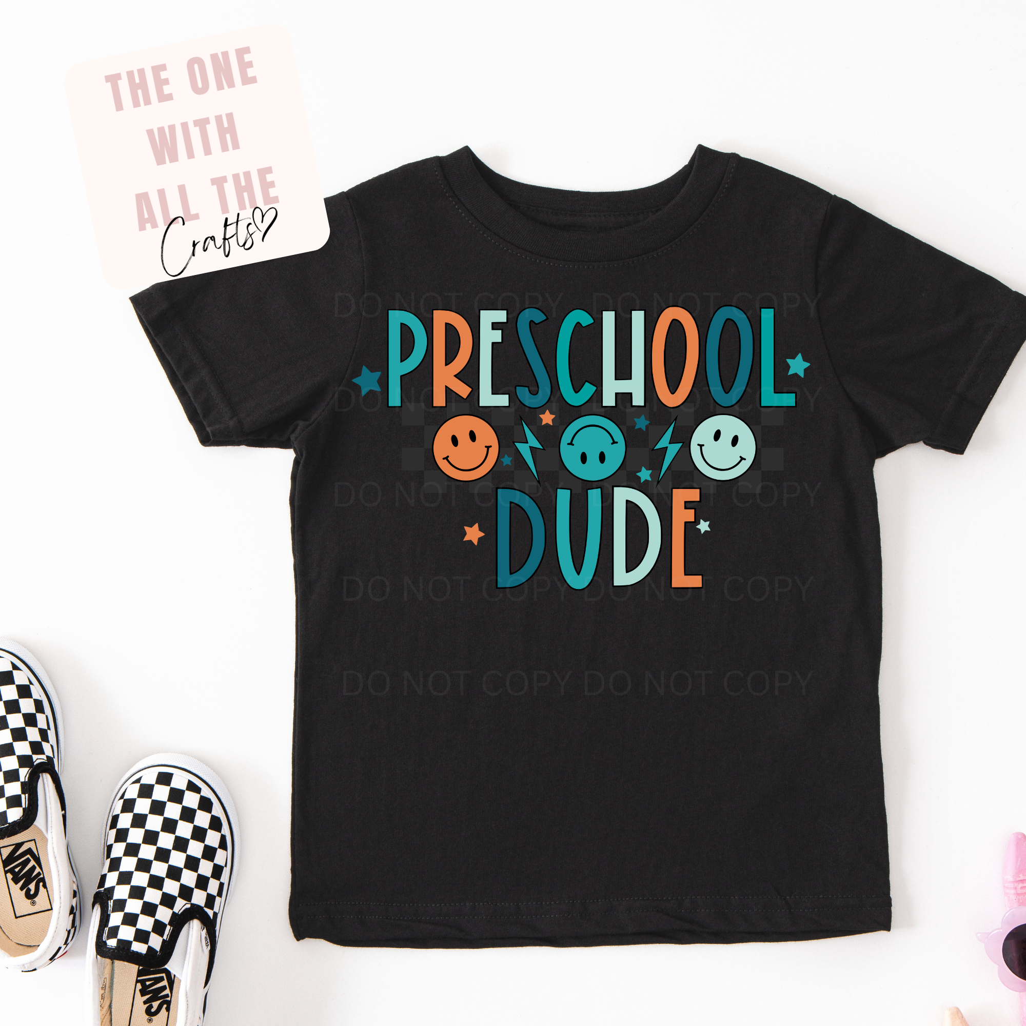 Black t-shirt with 'Preschool Dude' text and colorful graphics on a white background