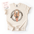 Beige t-shirt with cartoon character graphic on a white background