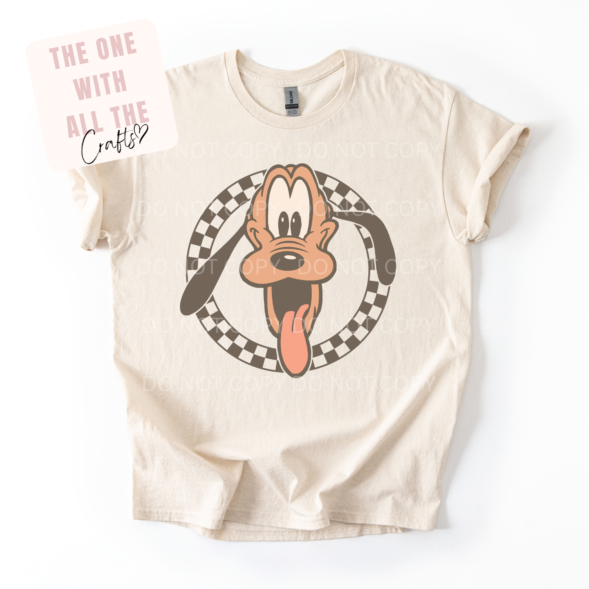 Beige t-shirt with cartoon character graphic on a white background