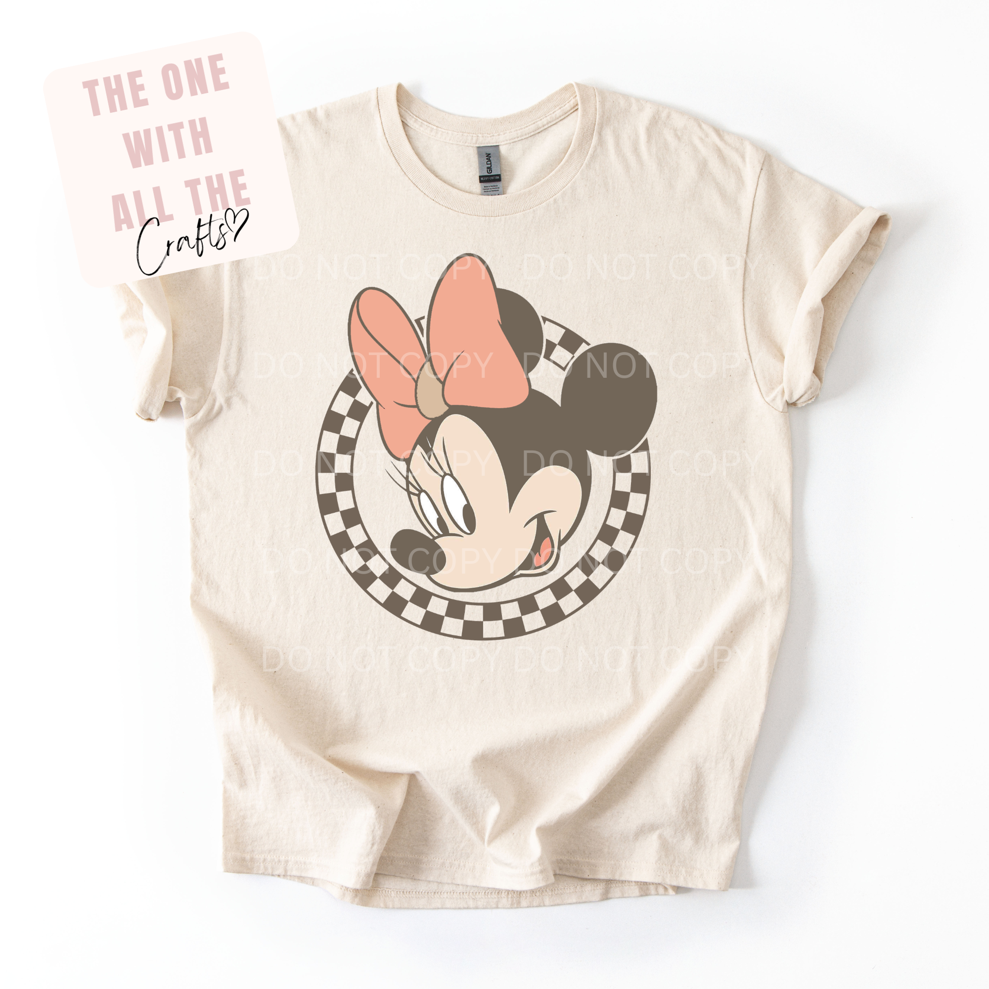 Beige t-shirt with Minnie Mouse graphic on a white background
