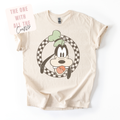 Beige t-shirt with cartoon character design on a white background