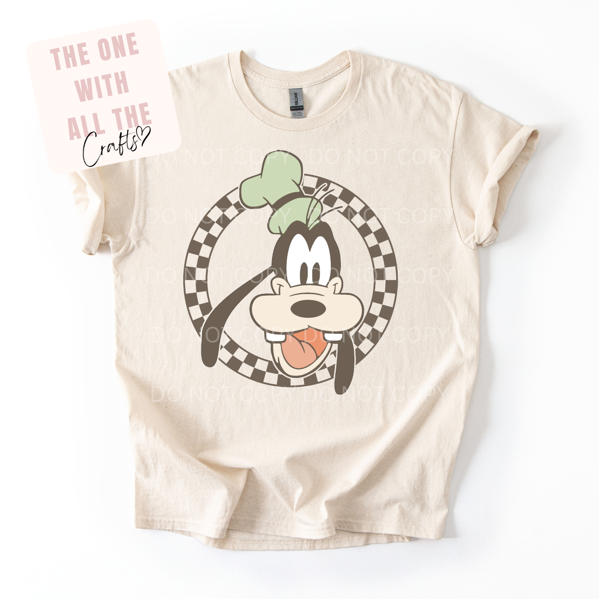 Beige t-shirt with cartoon character design on a white background