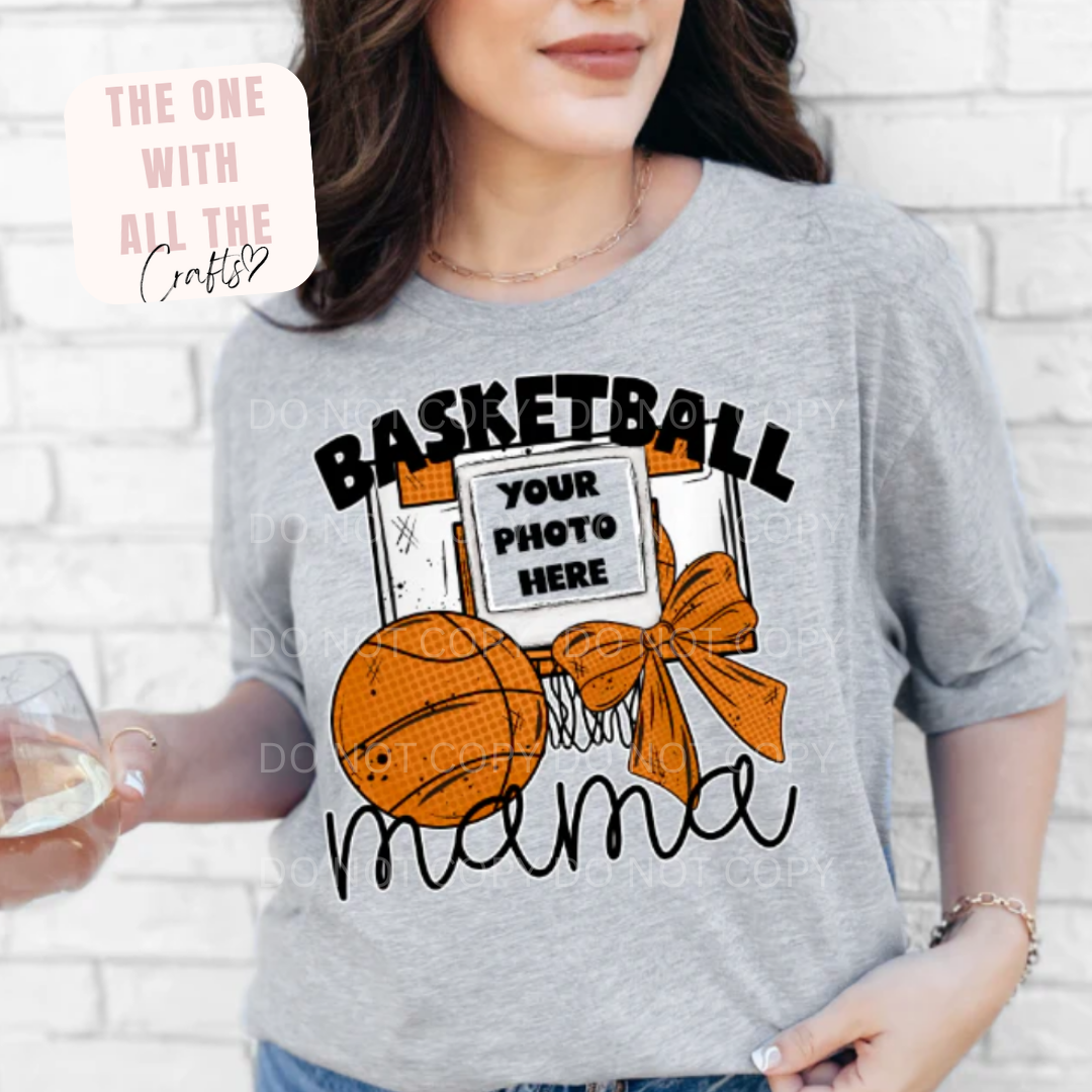 Person wearing a gray t-shirt with a basketball graphic and text.