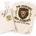 Tee shirt with the words 'The Heavens Are Roaring' on a plain white background