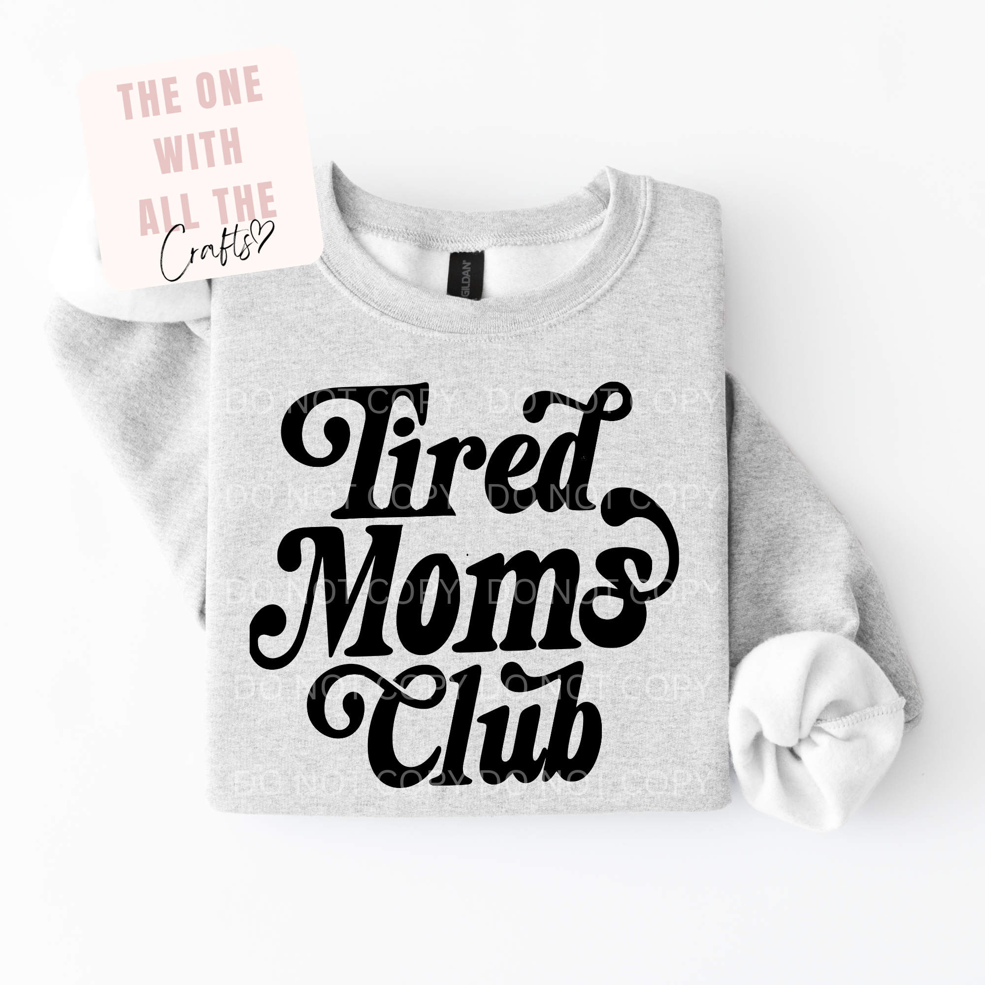 Gray sweatshirt with 'Tired Moms Club' text on a white background