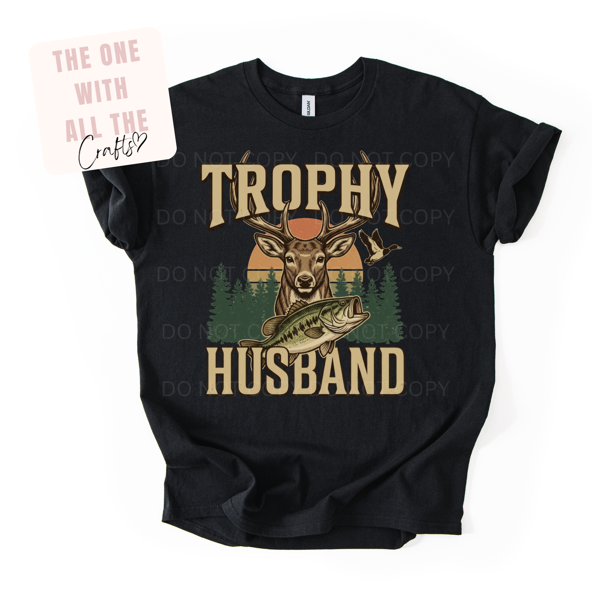 Black t-shirt with 'Trophy Husband' graphic design featuring a deer and fish, on a white background.